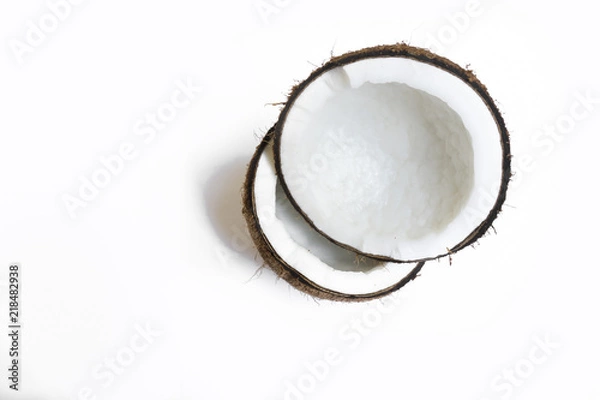 Obraz coconut broken isolated on a white background for making coconut milk , Or cosmetics for the spa.