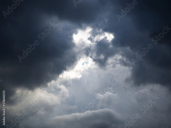 Fototapeta Dramatic sky and thick clouds and light beam.