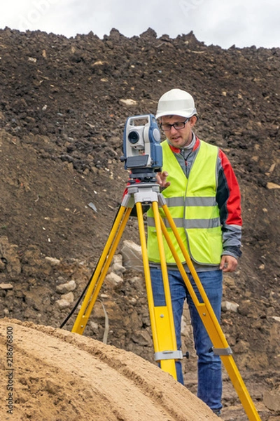 Fototapeta Cadastral survey of locality by surveyor