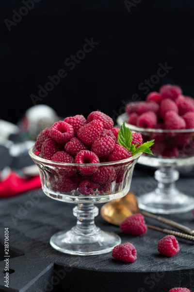 Fototapeta Fresh raspberry in a dessert bowl, copy space