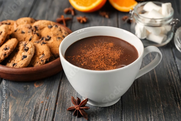 Fototapeta Cup of hot chocolate on wooden table