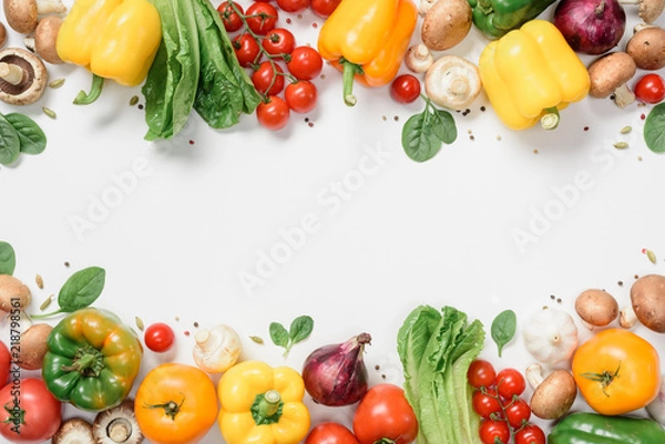 Fototapeta elevated view of frame made of ripe vegetables isolated on white