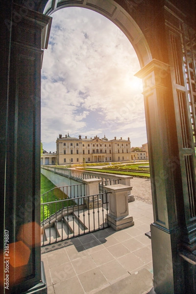 Obraz Bialystok, Poland, April 30, 2018: View through the arch of a metal pergola at Branicki Palace