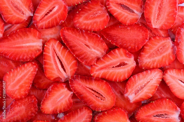 Obraz Fresh strawberry slice red background. Summer background texture of sliced strawberries.