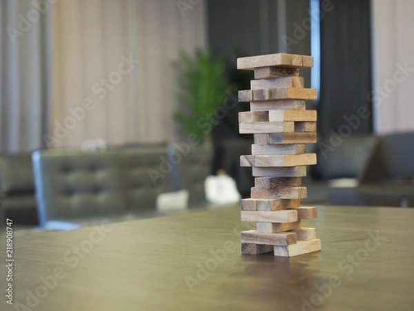 Fototapeta Wooded blocks tower stack game.