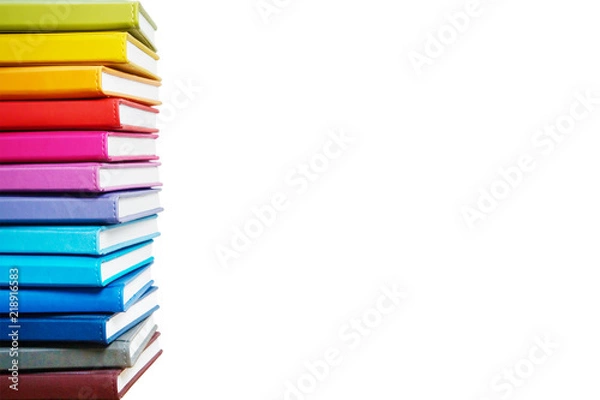 Obraz Books. A lot of books with bright covers in one pile isolated on white background. Place for text. Design element, paper and leather texture. Colorful books on the shelf, close up