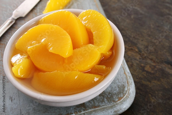 Fototapeta tinned peach slices in syrup