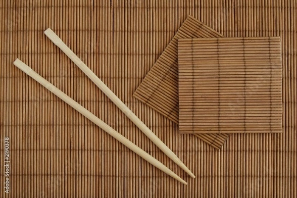 Fototapeta chopsticks and bamboo mat