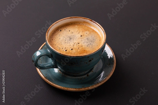 Obraz Cup of coffee on black background. Copy space. Top view. Flat lay.