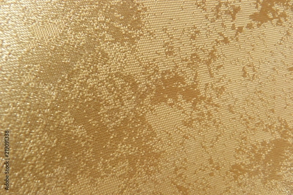 Obraz gold brocade fabric close-up natural linens creases padding oriental luxury shiny threads vintage organza curtains background for decor textured material uneven surface silk