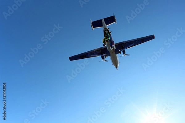 Fototapeta Two skydivers are falling in the amazing sky.