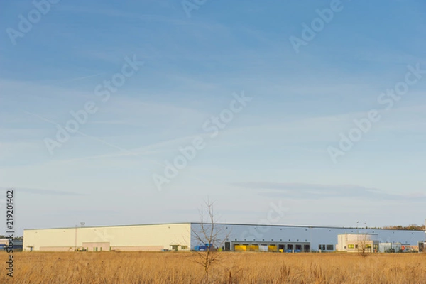 Fototapeta Modern industrial building over blue sky