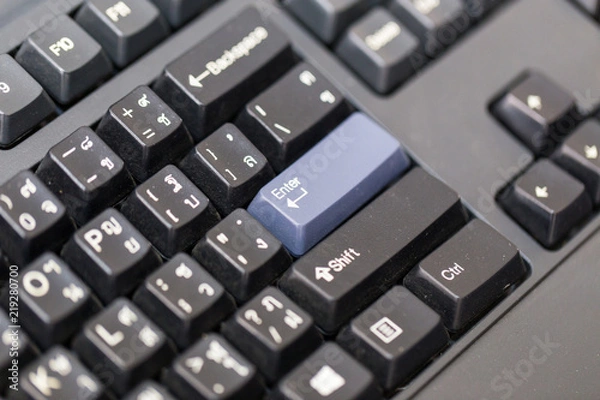 Fototapeta Keyboard with purple enter button