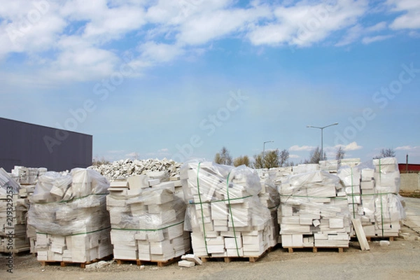 Fototapeta Defective aerated concrete blocks on pallets stored at warehouse