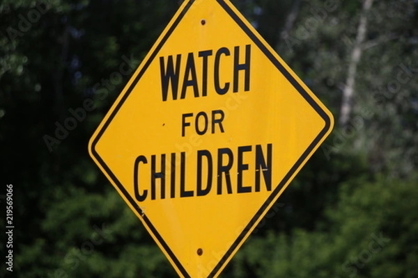 Obraz A Bright Yellow and Black Watch for Children Sign