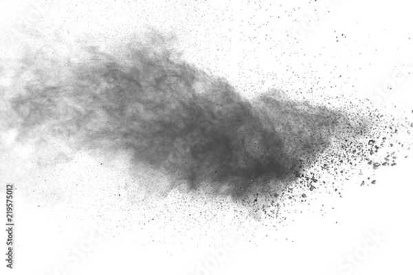 Obraz Black powder explosion against white background.