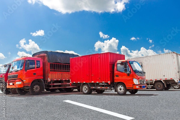 Obraz Red trucks docked in the square