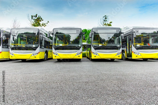 Fototapeta New electric bus parked in open-air parking lot
