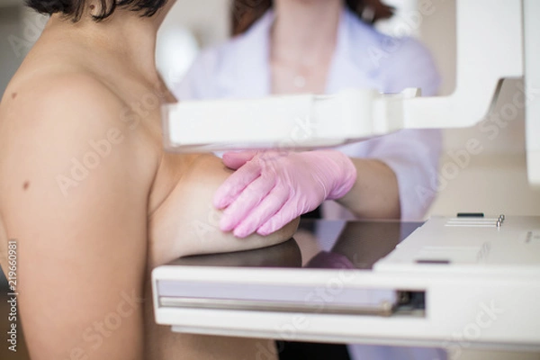 Fototapeta Close-up carrying out the ultrasound examination of the breast of a patient indoors