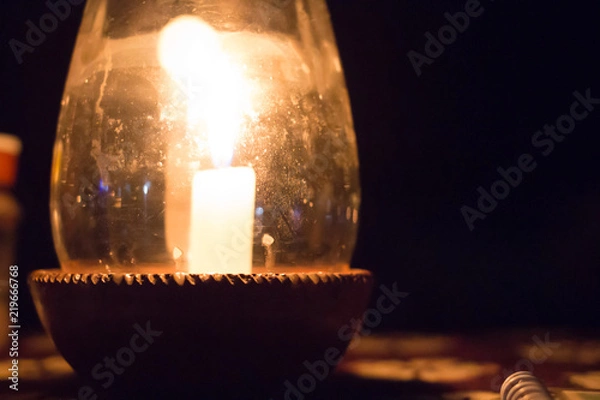 Fototapeta Candle in a Pot Under the Glass