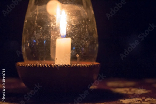 Fototapeta Candle in a Pot Under the Glass