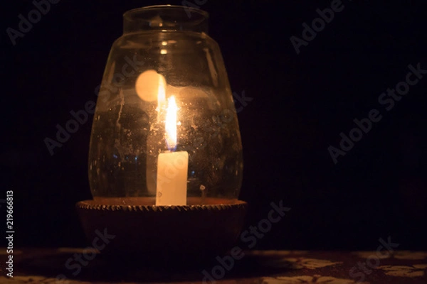 Fototapeta Candle in a Pot Under the Glass