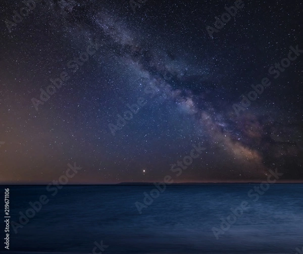 Obraz Vibrant Milky Way composite image over landscape of Beautiful long exposure beach