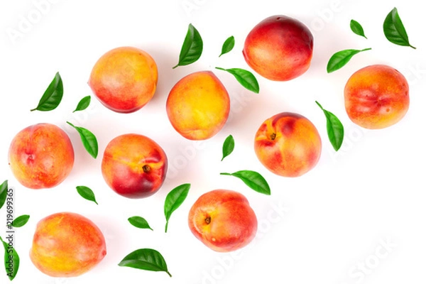 Fototapeta ripe nectarine with leaves isolated on white background with copy space for your text. Top view. Flat lay pattern
