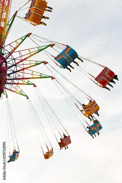 Obraz People who enjoy the attraction. High in the sky, a fun family day in an amusement park