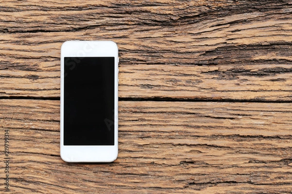 Fototapeta Empty Smartphone on brown wooden floor and have copy space.