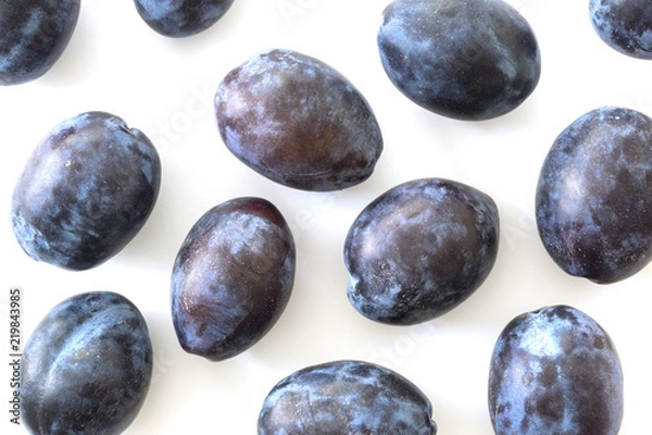 Obraz Plums on white background.