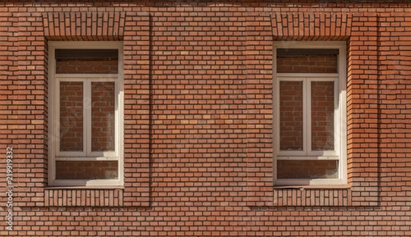 Fototapeta Red brick wall and windows
