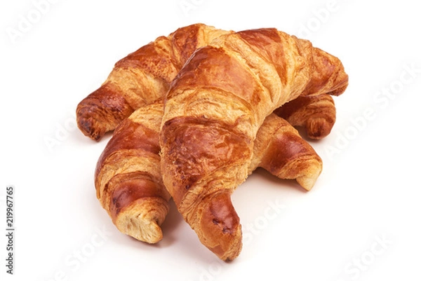 Fototapeta Freshly baked croissants, isolated on white background.