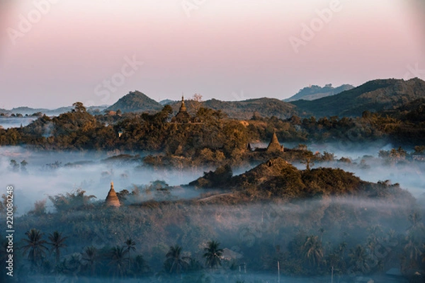 Obraz Buddha temple in the sunset dawn