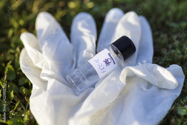 Fototapeta Illustration with mock up of Novichok agent (A-234) bottle and white rubber gloves on grass. Fictitious title on bottle in Russian: Novichok