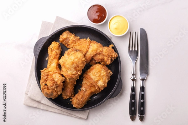 Fototapeta Crispy chicken legs. Fast and junk food