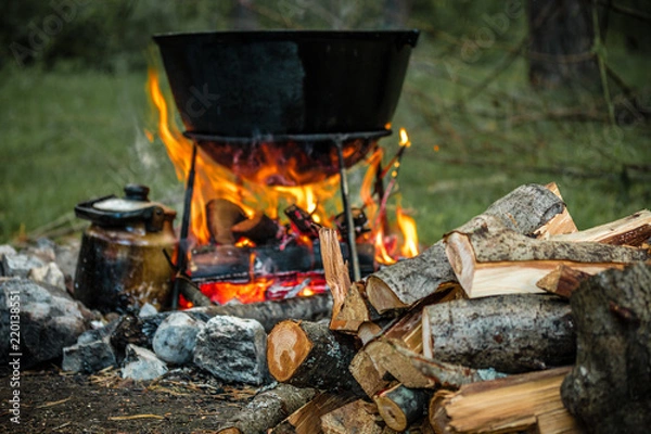 Fototapeta a cauldron for cooking is on the fire