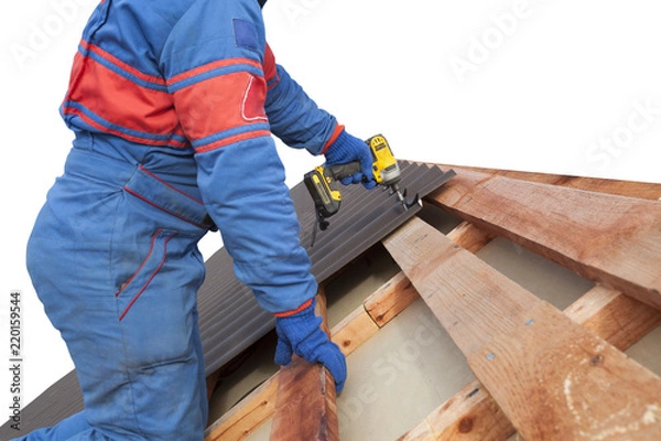 Obraz Man worker uses a power drill