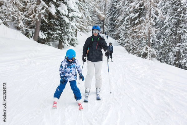 Obraz Father and child, skiing together in Austrian resort