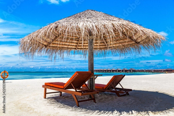 Fototapeta Sunbed and umbrella in the Maldives