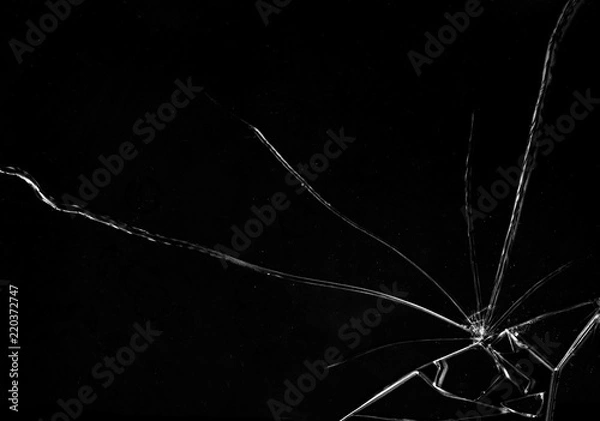 Obraz Shards of a broken glass on a black background, shattered pieces. Useful texture in overlay mode. Horizontal shot.

