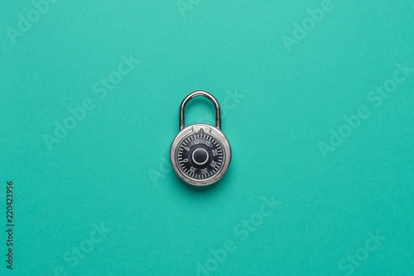 Fototapeta Dial Metal Combo Lock Front View locked on green background used