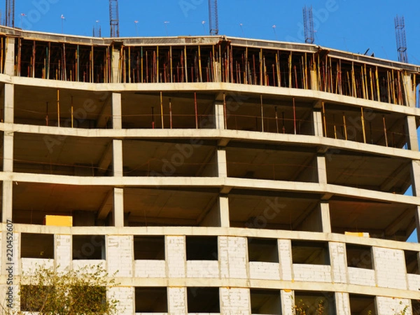 Obraz  Concrete building under construction. Construction site.