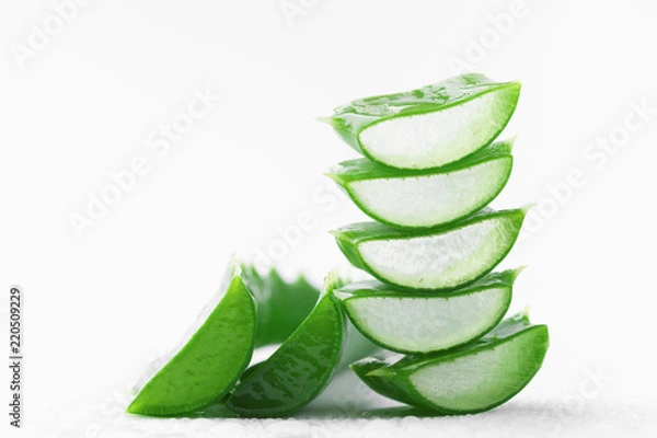 Fototapeta Aloe vera leaf slices with gel on white background.