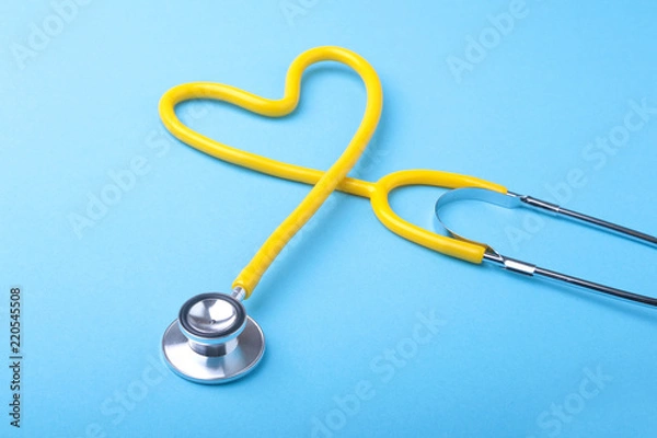 Obraz Red heart and a stethoscope on desk