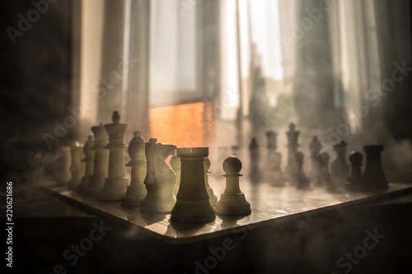 Fototapeta chess board game concept of business ideas and competition and strategy ideas concep. Chess figures on a background with window.