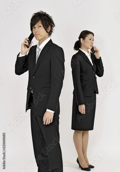 Fototapeta 電話するビジネスマンたち