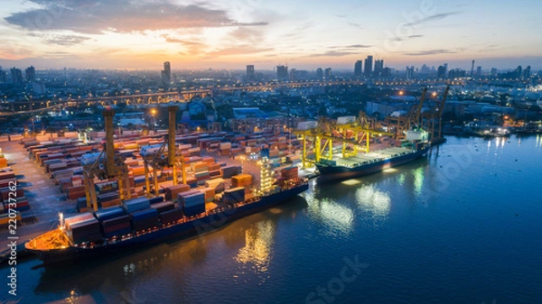 Obraz Aerial view container ship from sea port working for delivery containers shipment. Suitable use for transport or import export to global logistics concept.