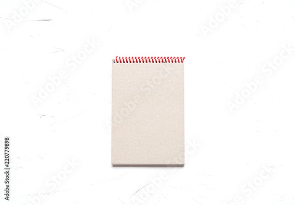 Fototapeta A notebook on concrete background, education ot busines concept