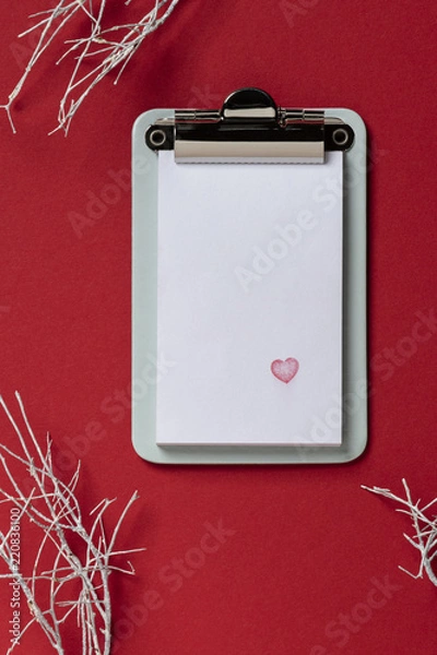 Fototapeta Clipboard on red background. Flat lay, top view trendy with heart
